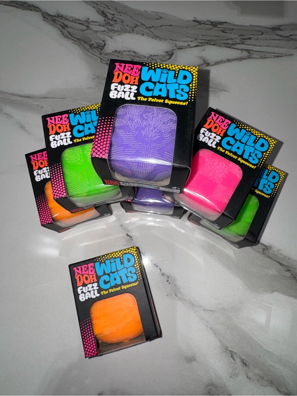 NeeDoh Wild Cats Fuzz Ball in Purple, Pink, Green, Orange